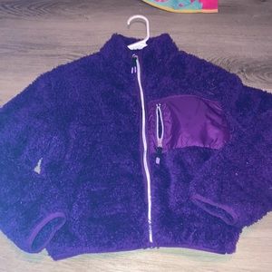 Dark purple H&M soft furry jacket with one pocket at front and two on the sides